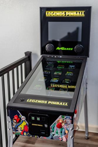 a video game machine on a shelf in a room at Breathtaking Roof Pool Views, Gameroom, Firepit in San Antonio