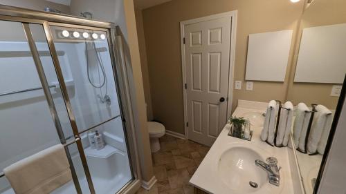 a bathroom with a shower and a sink and a toilet at Home Away From Home Charlotte in Charlotte