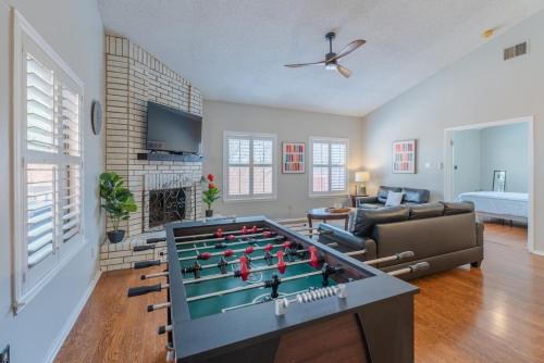 a living room with a large pool table at Beautiful Home with Pool, Games & Covered Patio in San Antonio