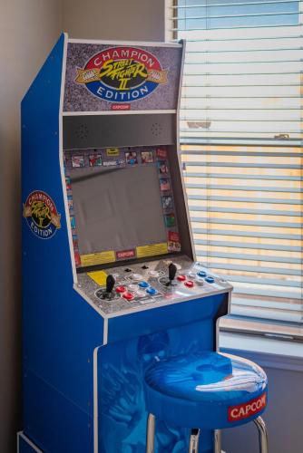 a game in a pop up studio with a stool at Beautiful Home with Pool, Games & Covered Patio in San Antonio