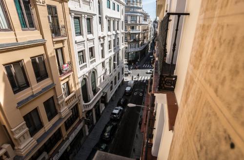 an aerial view of a city street with buildings at Apartamentos Caballero de Gracia in Madrid
