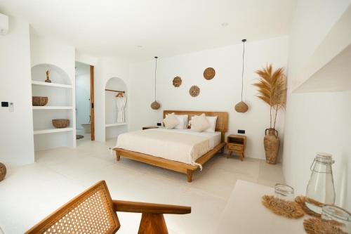 Postel nebo postele na pokoji v ubytování Adara Villas Uluwatu