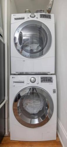 two washing machines are next to each other at Walk to 3 Breweries! 1 Bed Apartment on Grand in Des Moines