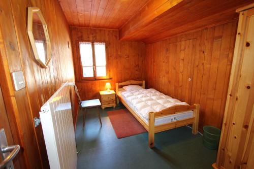 Ліжко або ліжка в номері Chalet Les Arolles