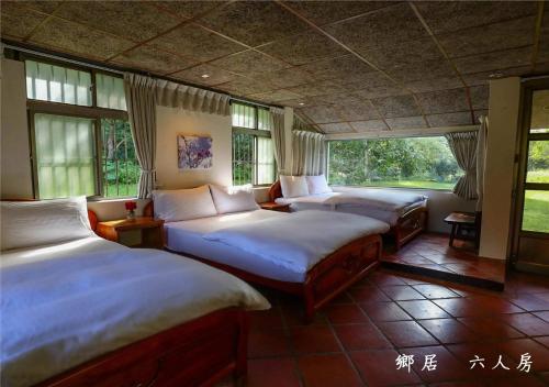 Postel nebo postele na pokoji v ubytování 玉蟾園民宿 寵物友善 YuChanYuan B&B