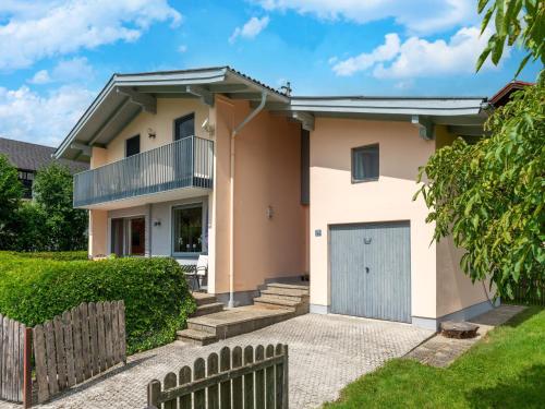 a house with a gate and a fence at Holiday Home Attersee near Hiking Trails in Attersee am Attersee