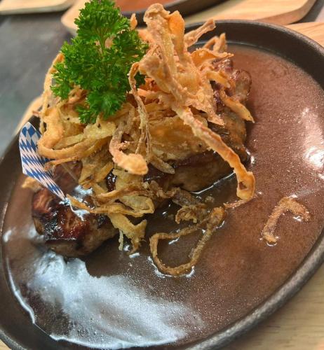a plate of food with a pile of food at Gasthof zur Sonne in Röfingen