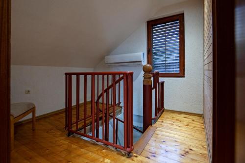 a staircase in a room with a stair railing at Bitrak House Megdani in Ohrid