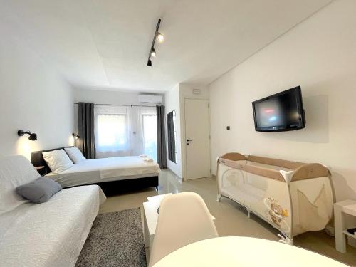 Postel nebo postele na pokoji v ubytování LAGUNA Apartments