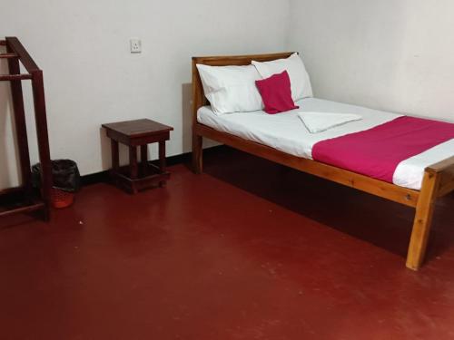 Postel nebo postele na pokoji v ubytování NR Villa Nilaveli