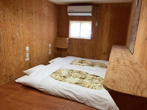 Postel nebo postele na pokoji v ubytování Guesthouse Otaru Wanokaze triple room / Vacation STAY 32203