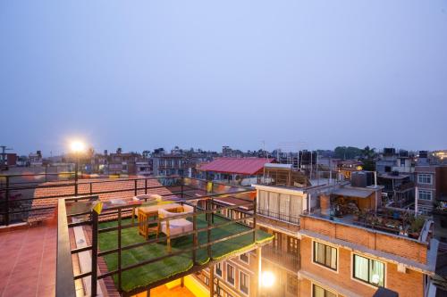 an overhead view of a city at night at vajra house in Pātan