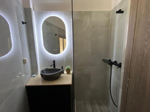 a bathroom with a sink and a mirror at Mirodaty's House in Rhodes Town