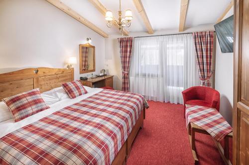 Posteľ alebo postele v izbe v ubytovaní Ski & Wellness Residence Družba