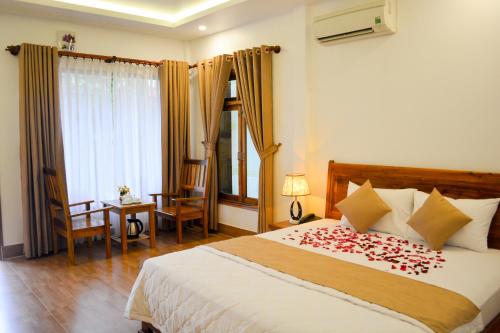 Postel nebo postele na pokoji v ubytování Ngoc Viet Bungalow