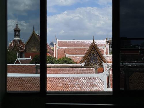 a view of a building from a window at Bella Bella House in Bangkok