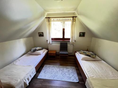 Postel nebo postele na pokoji v ubytování Domek w Szczyrku