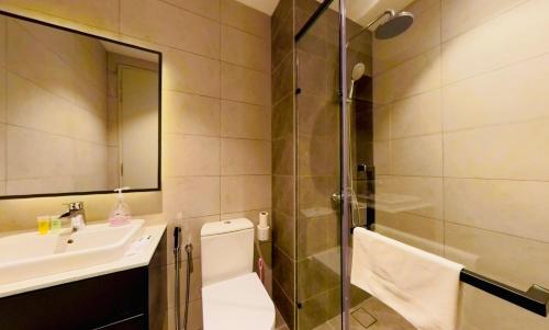 a bathroom with a sink and a shower at Axon Residence KLCC - KL HOME in Kuala Lumpur