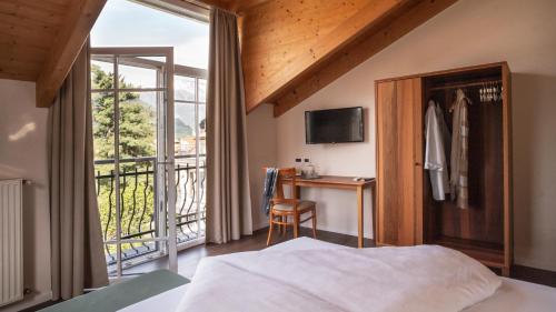 Postel nebo postele na pokoji v ubytování Hotel Villa Laurus