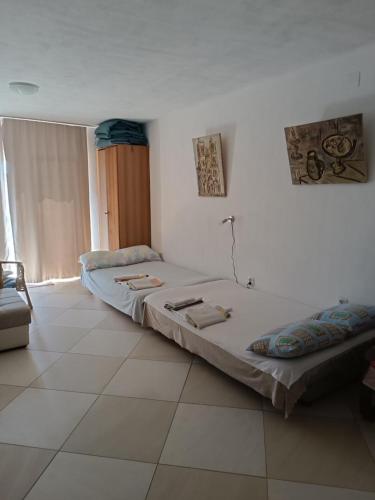 Ένα ή περισσότερα κρεβάτια σε δωμάτιο στο Bigova Bay Apartments