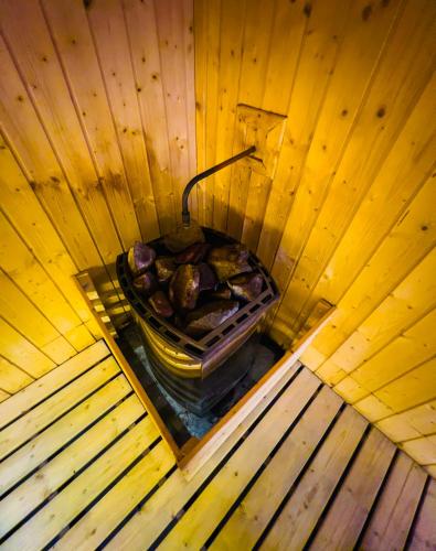 an overhead view of a bucket of food in a wooden sauna at Axon Residence KLCC - KL HOME in Kuala Lumpur