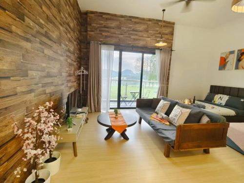 a living room with a couch and a table at Encorp Strand Suite by Luvit Stay in Petaling Jaya