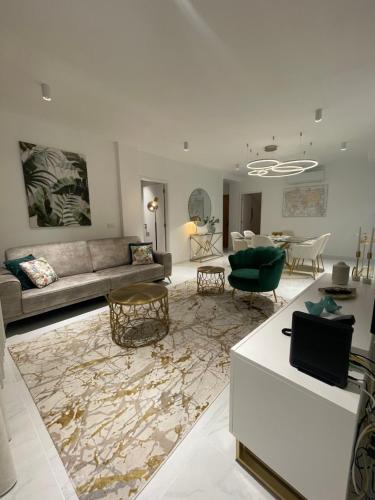 a living room with a couch and a table at Suites Avenue Azores in Horta