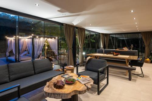 a living room with a couch and a table at Casa al Lavere' in Bale