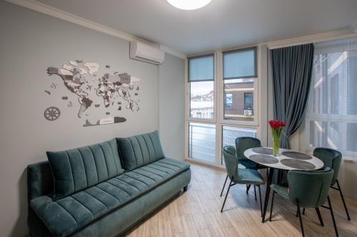 a living room with a couch and a table at Old City apart in Lviv