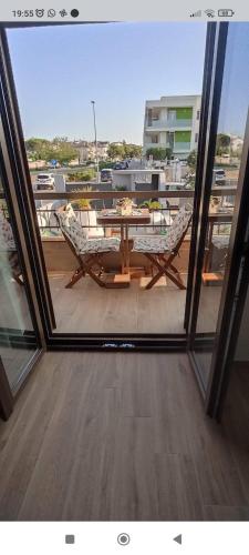 a view of a table and chairs from a window at Regina di Puglia in Santeramo in Colle
