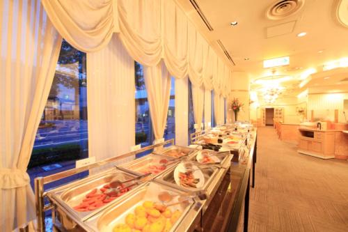 a buffet line of food in a hotel room at Takasaki Washington Hotel Plaza in Takasaki
