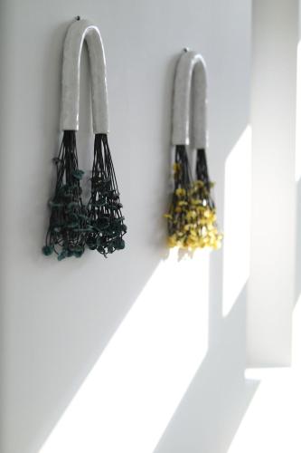 a group of cables hanging from a wall at Skiti Villas Green Holidays in Skíti