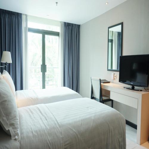 Ένα ή περισσότερα κρεβάτια σε δωμάτιο στο Kristal Hotel Jakarta