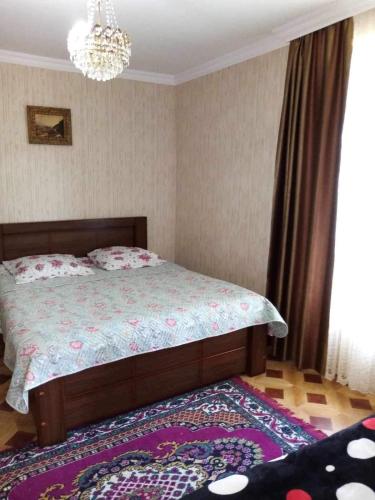 Postel nebo postele na pokoji v ubytování Tskaltubo Guesthouse Oda