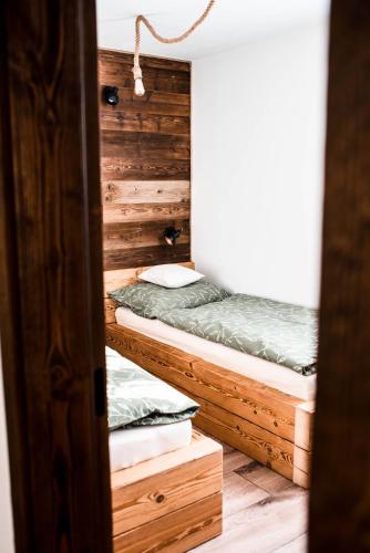 a room with two bunk beds in it at Apartmány ZeMě in Nové Město pod Smrkem