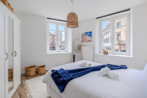 Postel nebo postele na pokoji v ubytování Travel Homes - CityStar - Espace et Confort en plein centre, sur-équipé