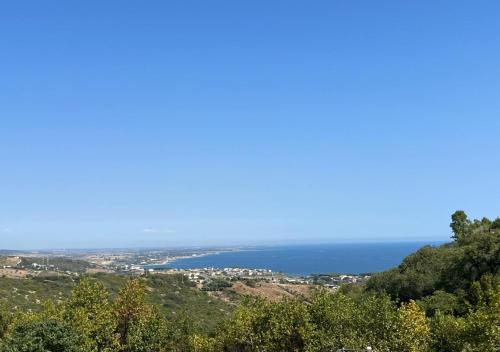 a view of the ocean from the top of a hill at Karma Rural Buenavista in Santa Marinella