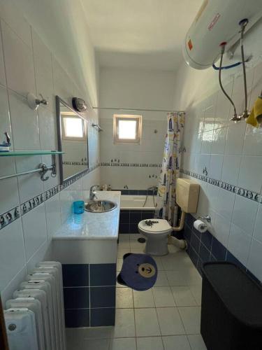 a bathroom with a sink and a toilet at colored houses in Ierapetra