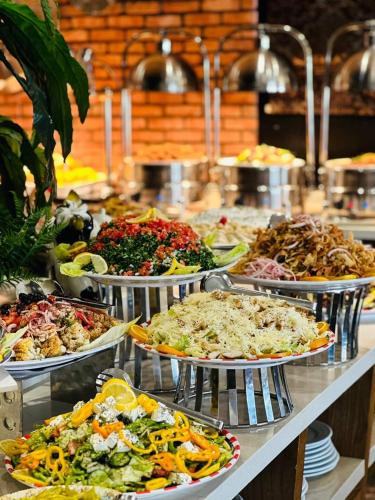 a buffet line with many different types of food at Hyksos Hotel in Erbil