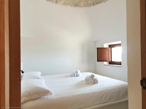 Postel nebo postele na pokoji v ubytování Trullo Mela comfort, 6 people, 10 minutes Alberobello
