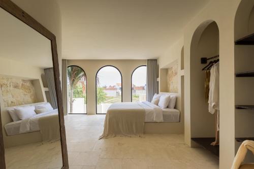 Ένα ή περισσότερα κρεβάτια σε δωμάτιο στο Villa Sawa Great Location , Pererenan by OriVista