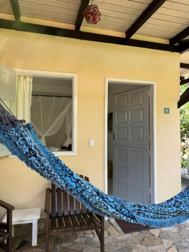 a staircase leading to the front door of a house at Pousada Horizonte Azul in Ilha de Boipeba