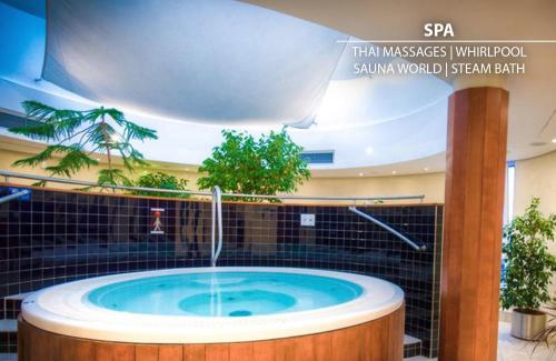 a hot tub in a room with a fountain at Don Giovanni Hotel Prague - Great Hotels of The World in Prague