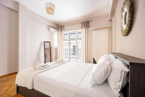 Postel nebo postele na pokoji v ubytování GK Niki by GK Properties