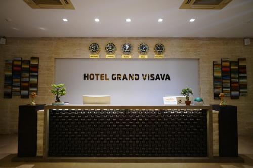 a hotel grand viewaya sign on a wall at Hotel Grand Visava Lonavala in Lonavala