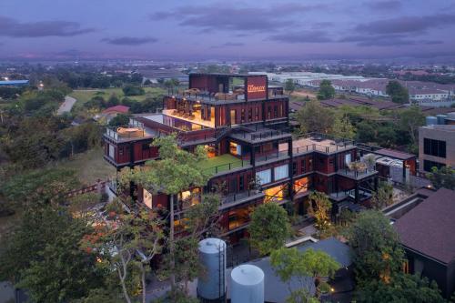 an aerial view of a large building with trees at The Gems Mining Pool Villas Pattaya in Nong Prue