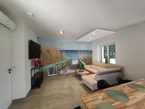 a living room with a view of the ocean at WHITE HOUSE in Jastrzębia Góra
