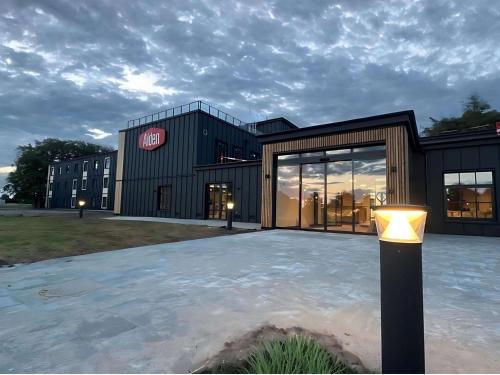 a building with a light in front of it at Aiden by Best Western Lolland in Holeby