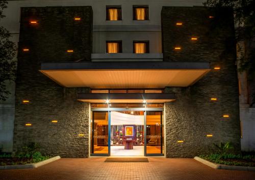 an entrance to a building with a lit up door at The RidgePoint Hotel in Witbank