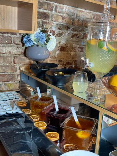 a buffet with drinks and other items on a counter at Aria Palace Taksim in Istanbul